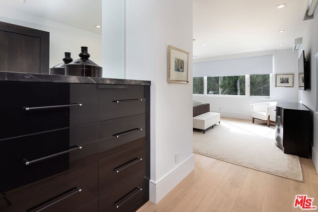 bedroom with light hardwood / wood-style flooring