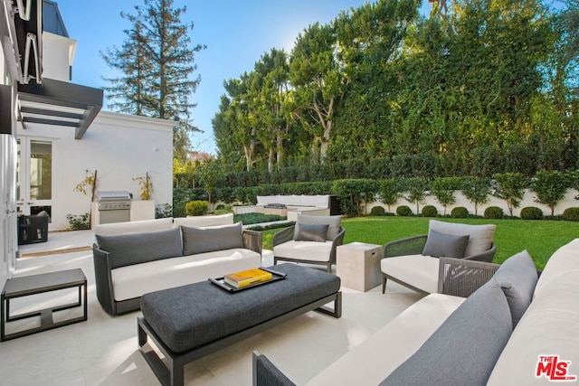 view of patio with an outdoor living space, grilling area, and exterior kitchen