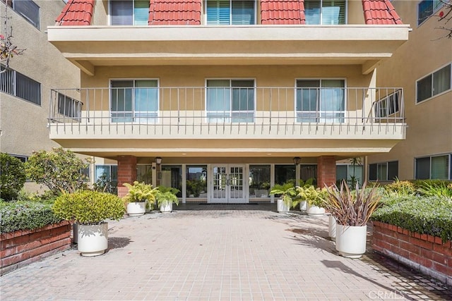 5845 Doverwood Dr Unit 216, Culver City, CA 90230 - entrance to property with a tile roof, french doors, and stucco siding
