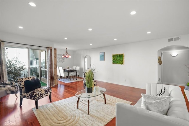 5845 Doverwood Dr Unit 216, Culver City, CA 90230 - living area with arched walkways, wood finished floors, recessed lighting, and a chandelier