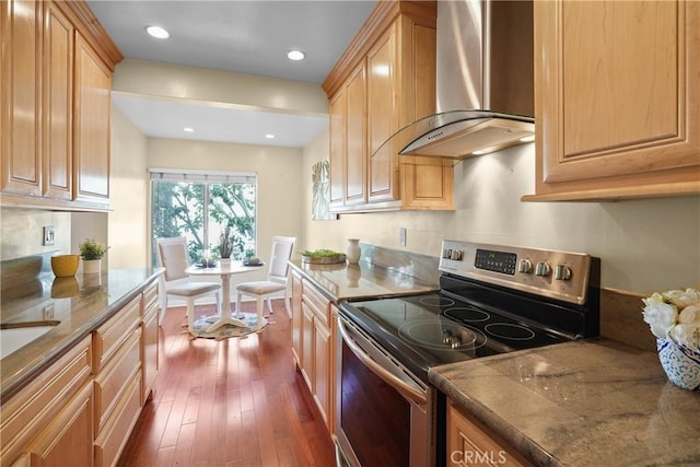 5845 Doverwood Dr Unit 216, Culver City, CA 90230 - kitchen with stainless steel electric range, wall chimney range hood, dark wood finished floors, stone countertops, and recessed lighting