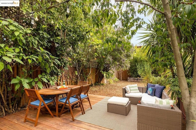 wooden deck featuring an outdoor living space