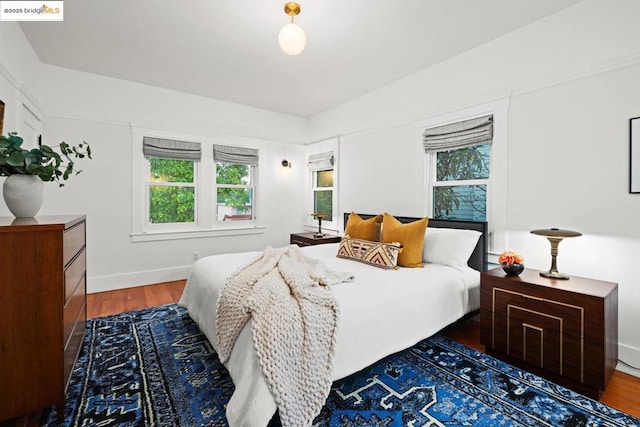 bedroom featuring dark hardwood / wood-style flooring