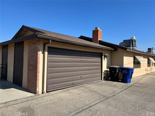 view of side of property featuring a garage