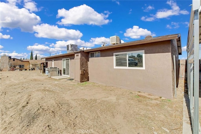 back of property with central AC unit