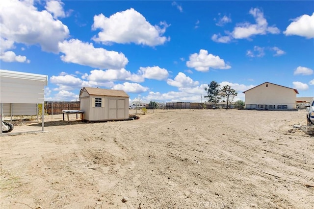 view of yard with a storage shed