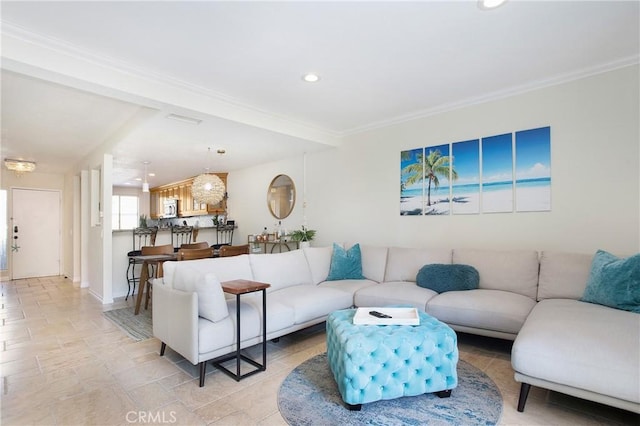 living room featuring crown molding