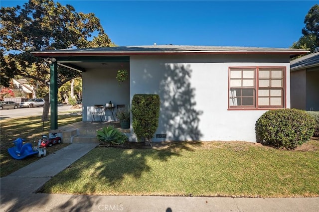 view of home's exterior with a yard