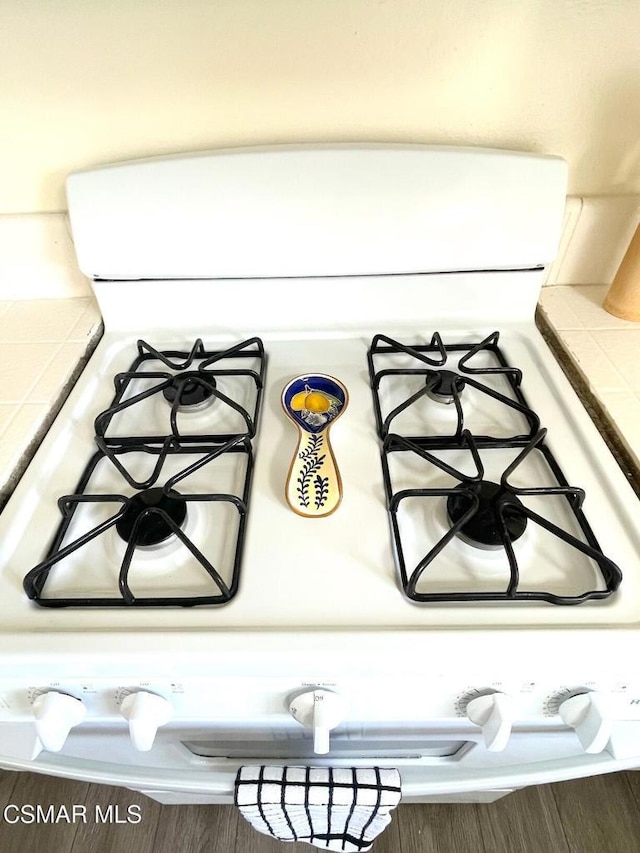 room details featuring white range with gas cooktop