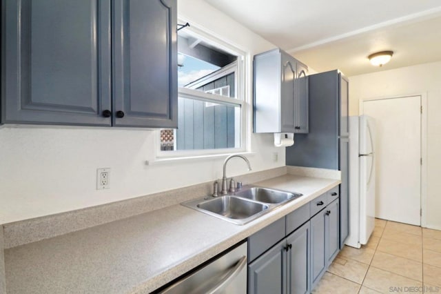 kitchen with sink, light tile patterned floors, stainless steel dishwasher, and white fridge