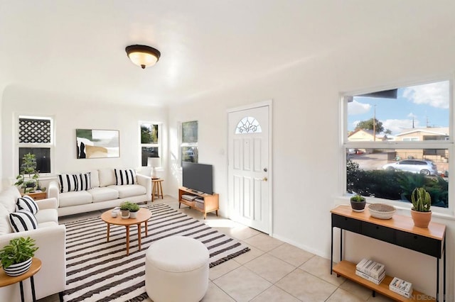 tiled living room with a healthy amount of sunlight