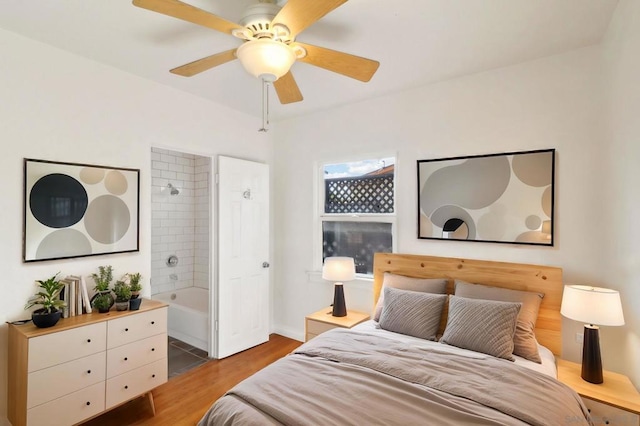 bedroom with dark hardwood / wood-style floors and ceiling fan