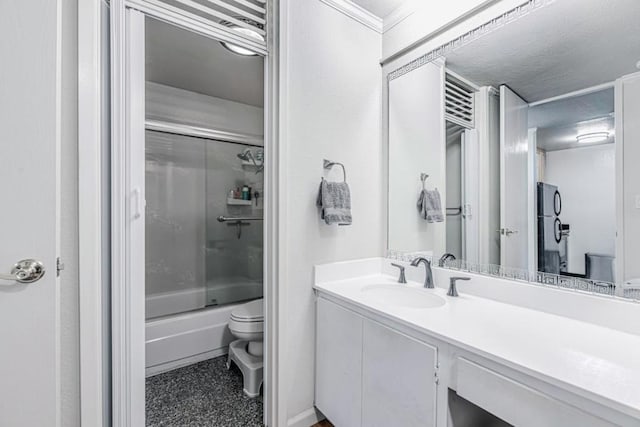 full bathroom with enclosed tub / shower combo, vanity, toilet, and a textured ceiling