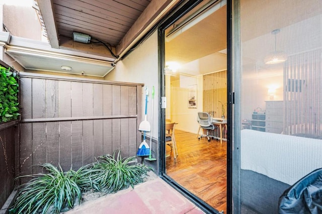 entrance to property featuring a balcony