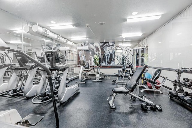 gym with a textured ceiling