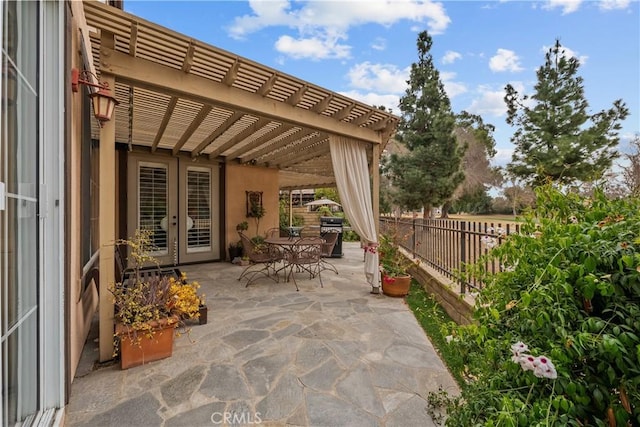 26800 Monet Ln, Valencia, CA 91355 - view of patio with fence, outdoor dining area, and a pergola