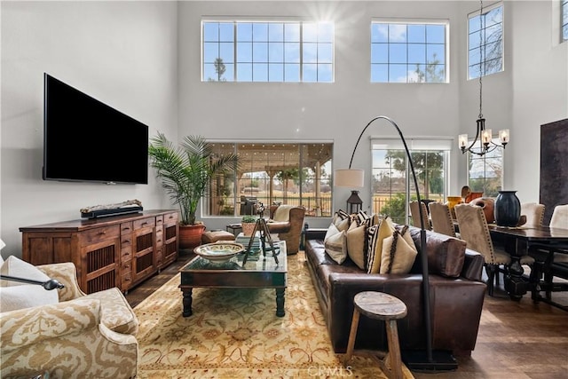 26800 Monet Ln, Valencia, CA 91355 - living room with a chandelier, a towering ceiling, and wood finished floors