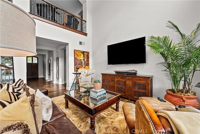 26800 Monet Ln, Valencia, CA 91355 - living area with baseboards, a high ceiling, visible vents, and wood finished floors