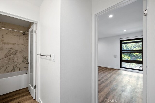 corridor featuring dark hardwood / wood-style flooring