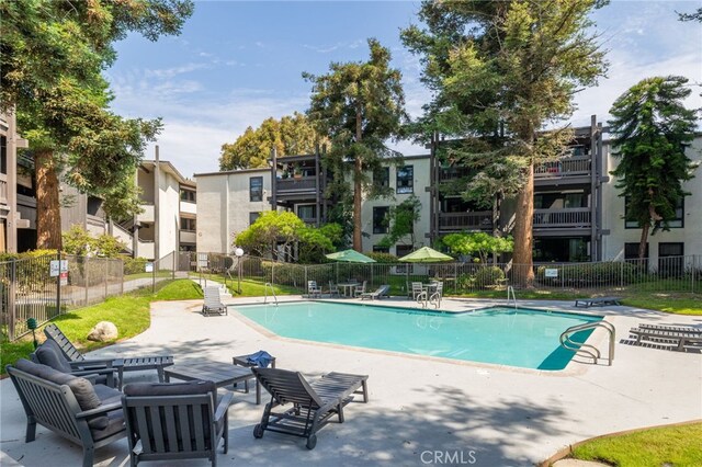 view of swimming pool featuring a patio area