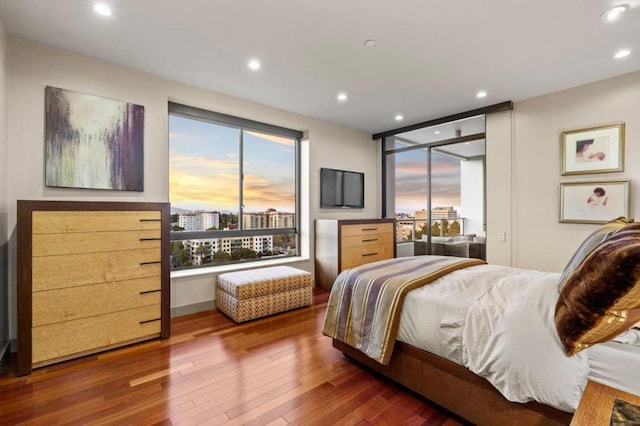 bedroom with hardwood / wood-style flooring