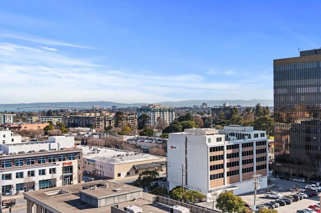 property's view of city featuring a mountain view