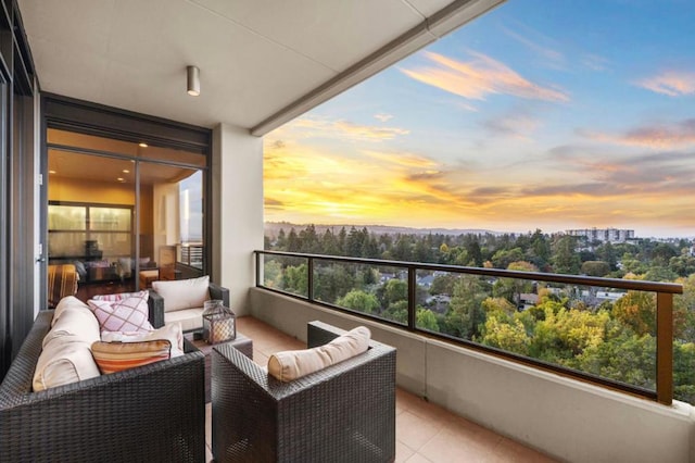 balcony at dusk featuring outdoor lounge area