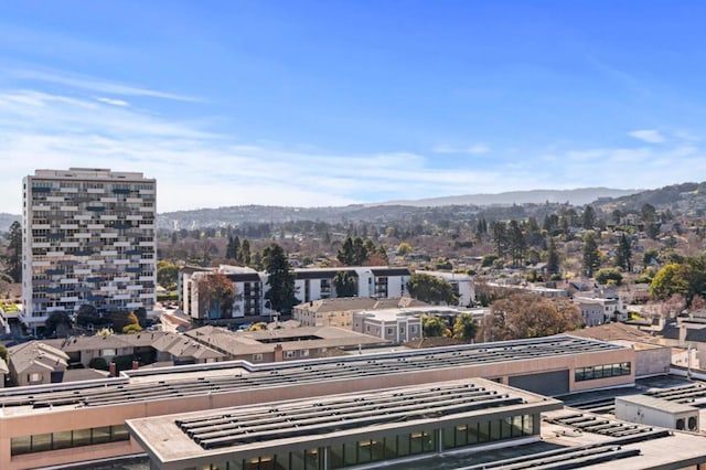 property's view of city featuring a mountain view