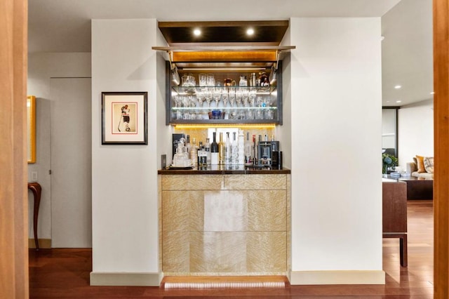 bar with hardwood / wood-style flooring