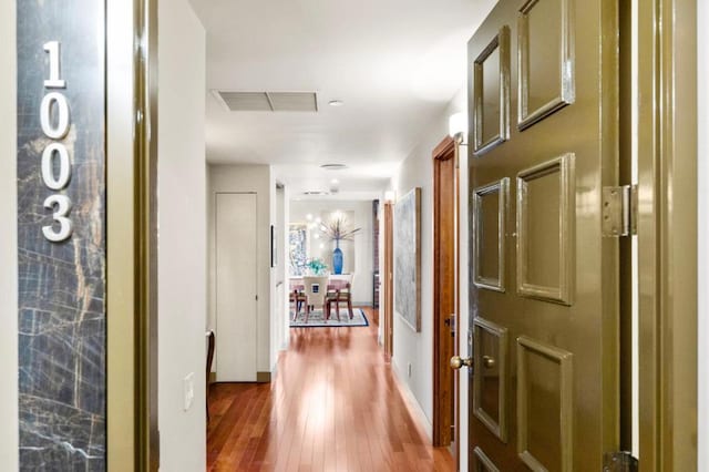 corridor with wood-type flooring