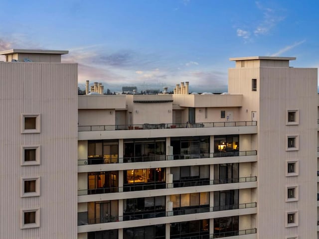 view of outdoor building at dusk