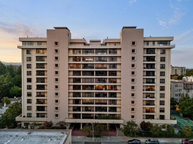 view of outdoor building at dusk