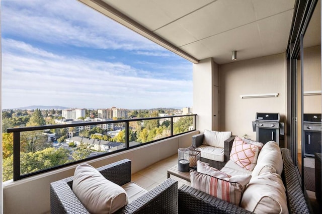 balcony featuring an outdoor hangout area and grilling area