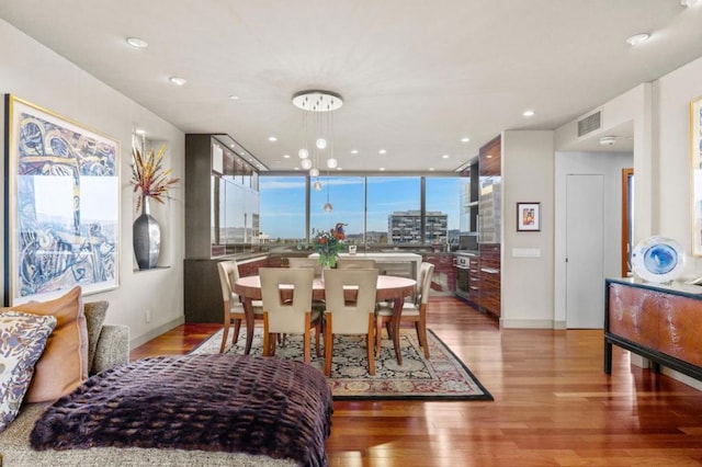 dining space with light wood-type flooring