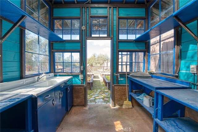 interior space featuring concrete flooring and sink