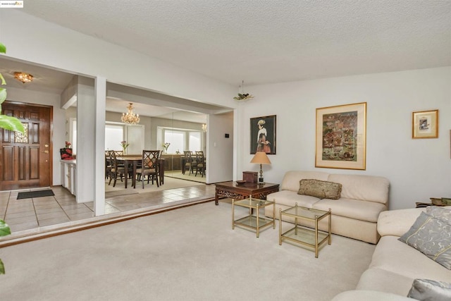 carpeted living room with a textured ceiling