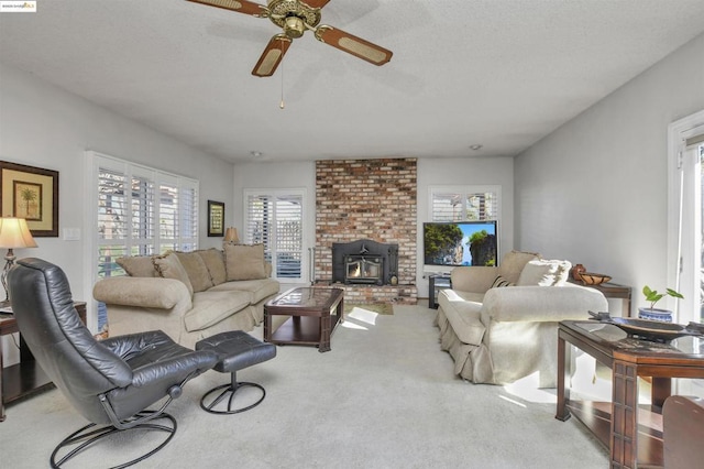 living room with light carpet and ceiling fan