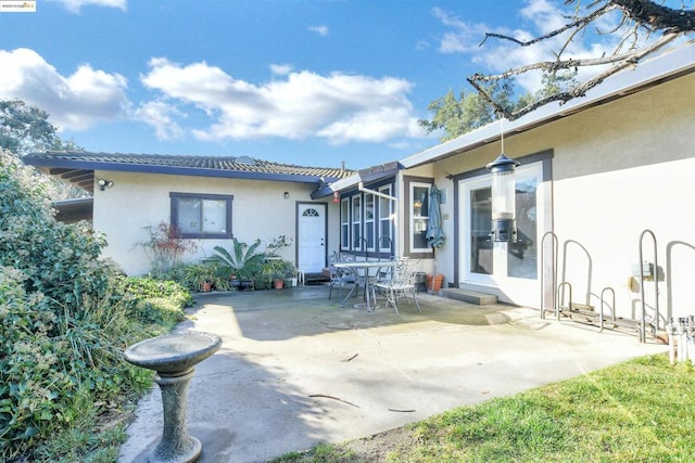 rear view of house with a patio