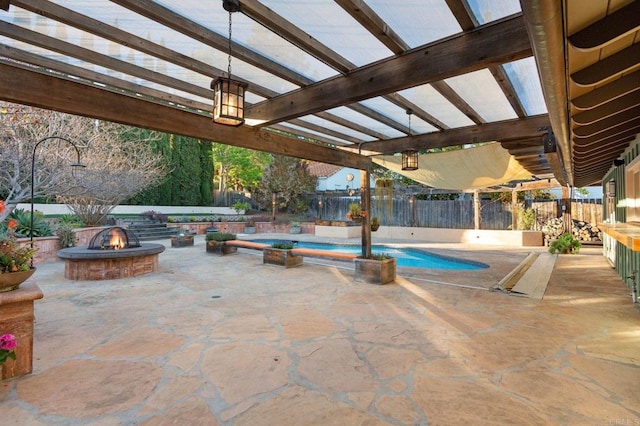 view of pool featuring a pergola, a fire pit, and a patio