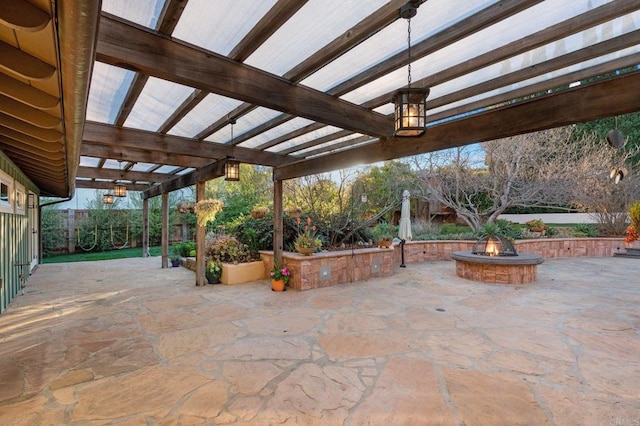 view of patio / terrace featuring a pergola and a fire pit