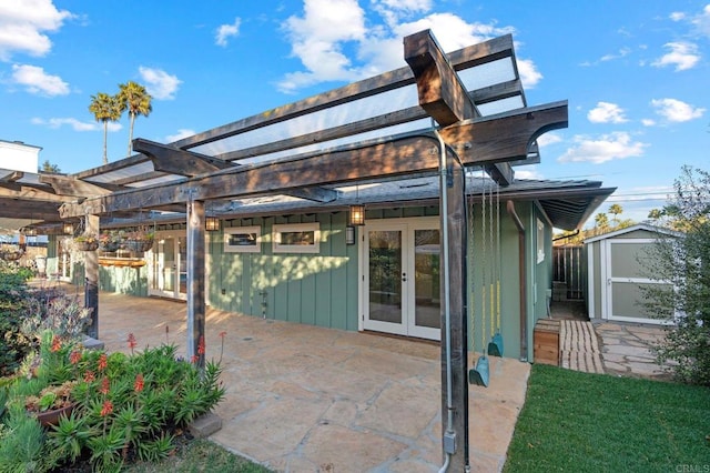 view of patio / terrace featuring french doors and a pergola