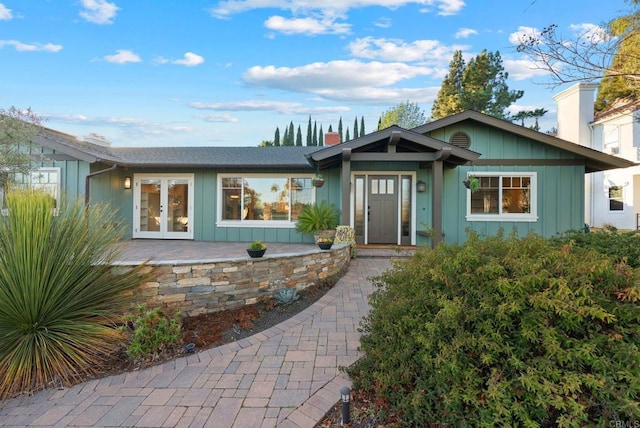 ranch-style home featuring french doors