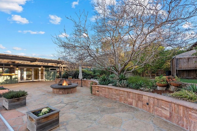 view of patio with a fire pit