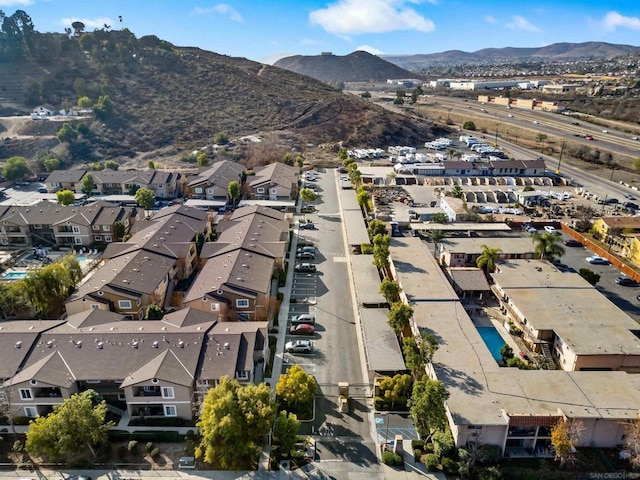 birds eye view of property with a mountain view