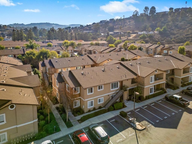 birds eye view of property with a mountain view