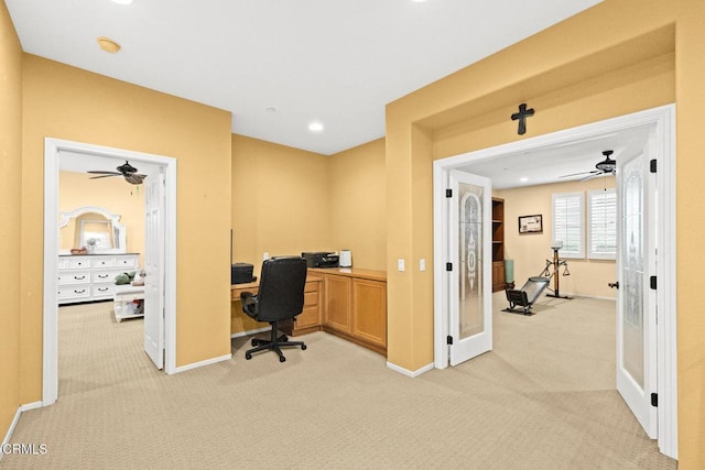 office with light colored carpet and french doors