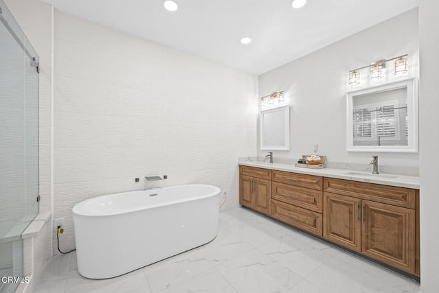 bathroom with vanity and a bathtub