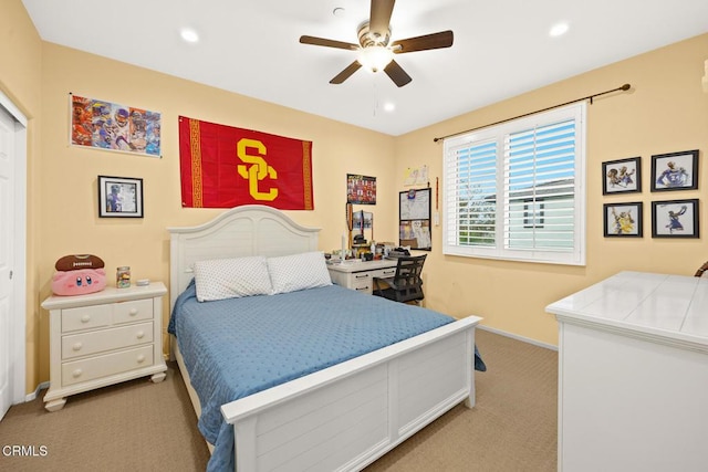 carpeted bedroom with ceiling fan