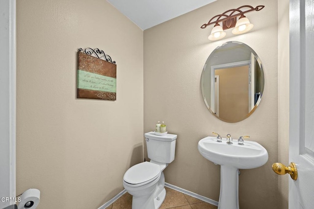 bathroom featuring tile patterned floors and toilet