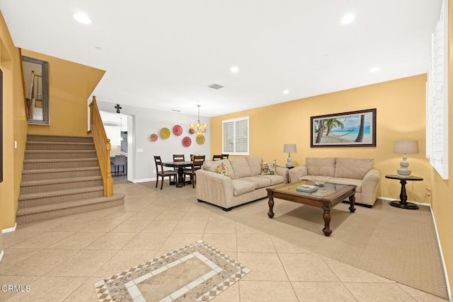 tiled living room with a chandelier